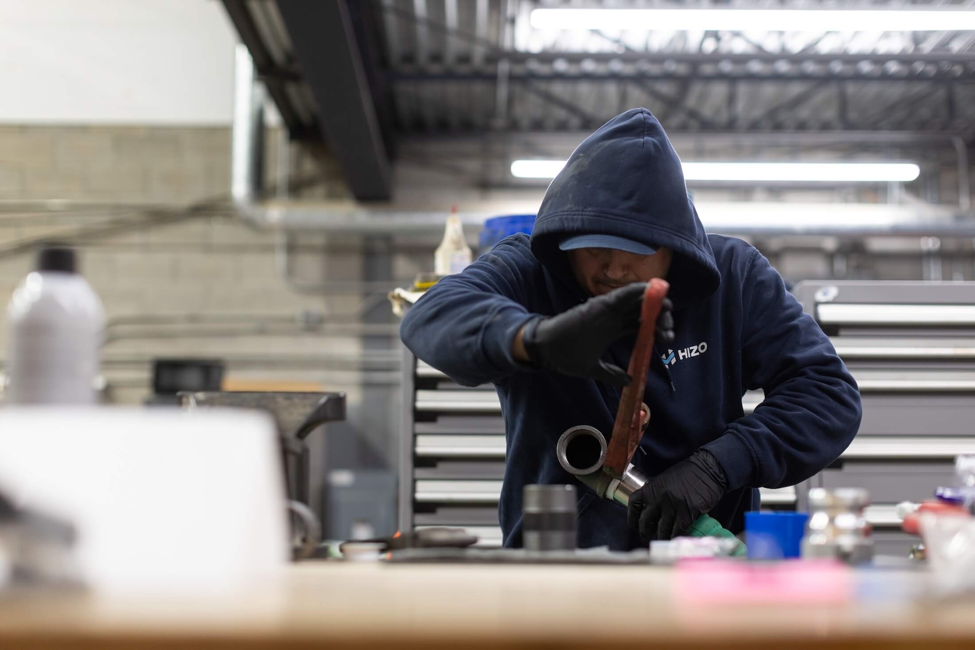 HIZO technician assembling equipment fittings