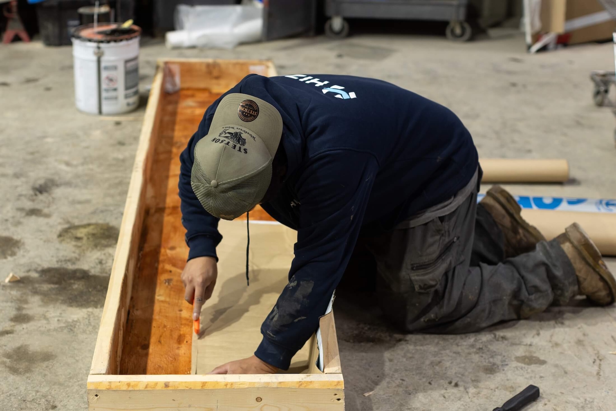 HIZO technician working on floor-level insulation mold