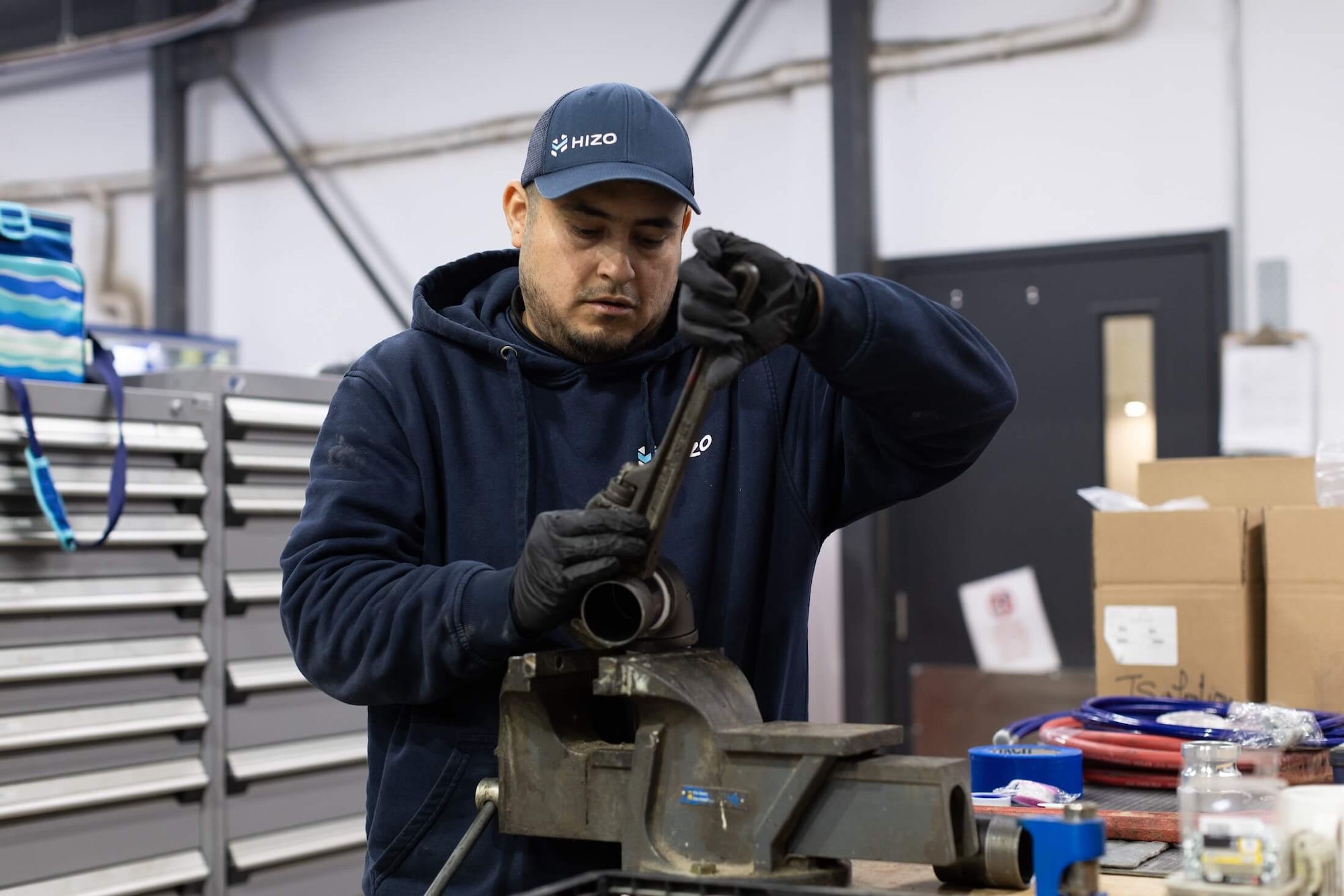 HIZO technician preparing spray equipment
