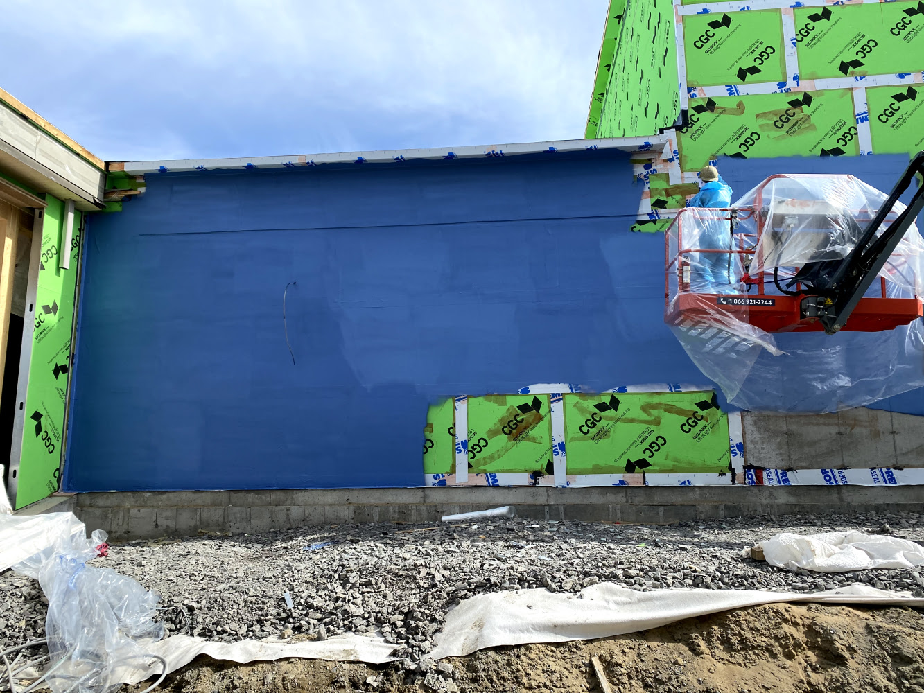 Membrane liquide pare-air bâtiment commercial Québec HIZO